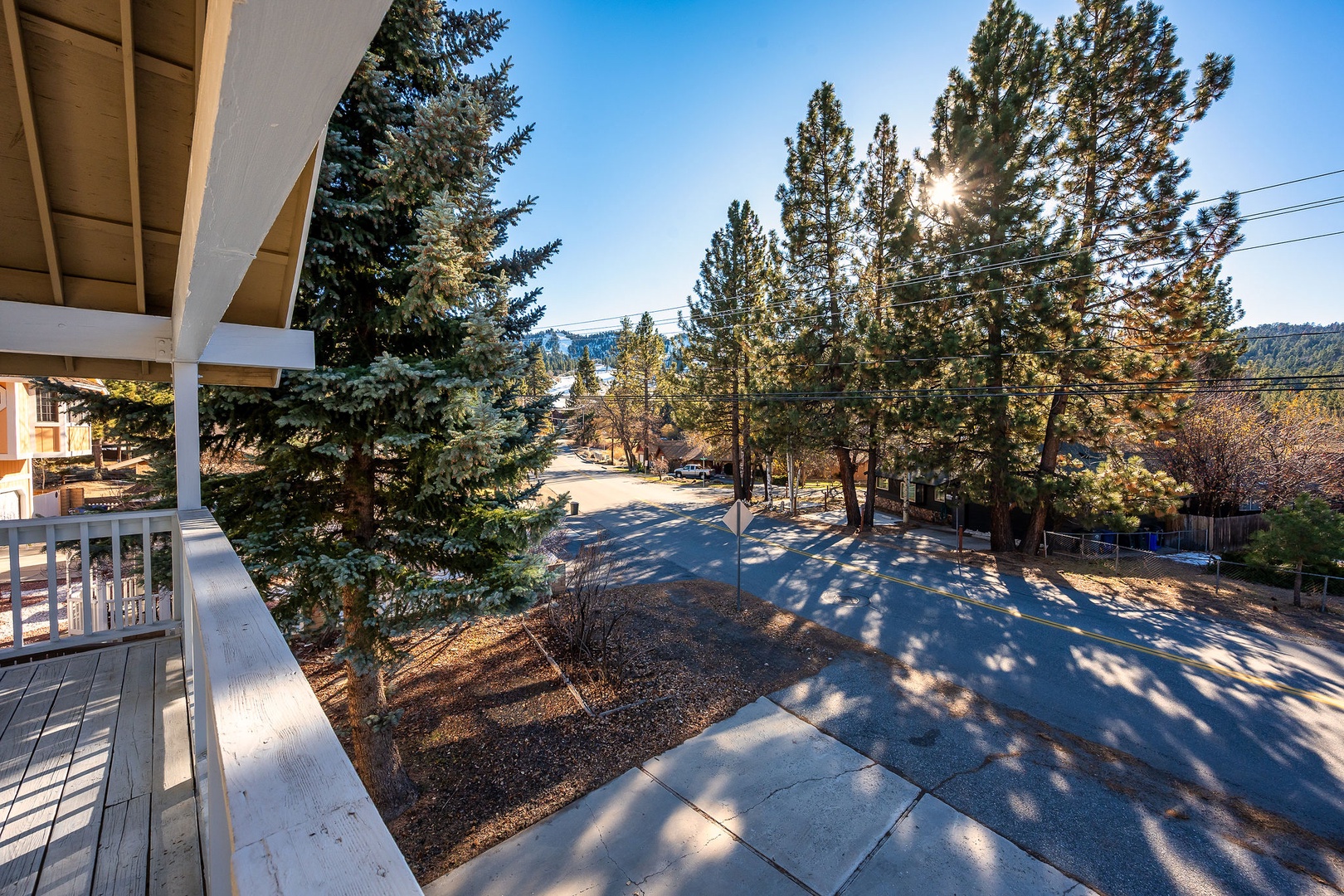 Your balcony offers peaceful views of the tree-lined neighborhood and distant mountains, perfect for morning coffee or evening relaxation.