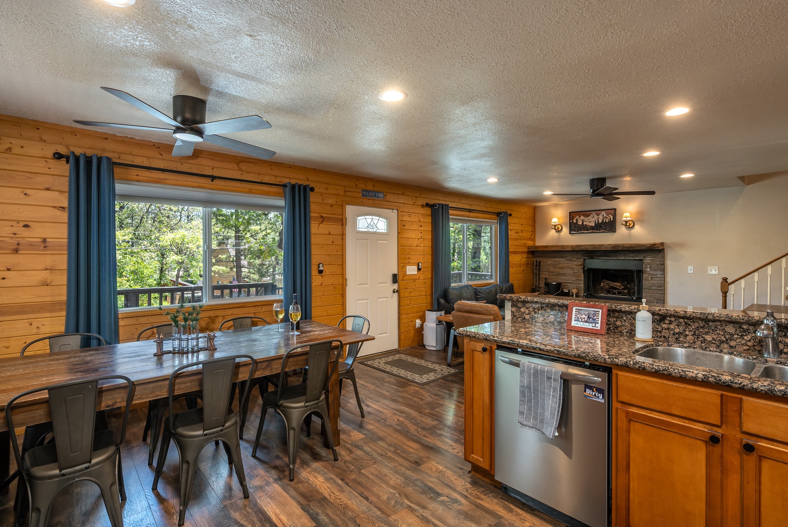 Step into your cozy mountain retreat where warm pine walls meet modern comfort. Natural light streams through large windows, your dining table awaits gatherings, and the granite kitchen invites culinary adventures.