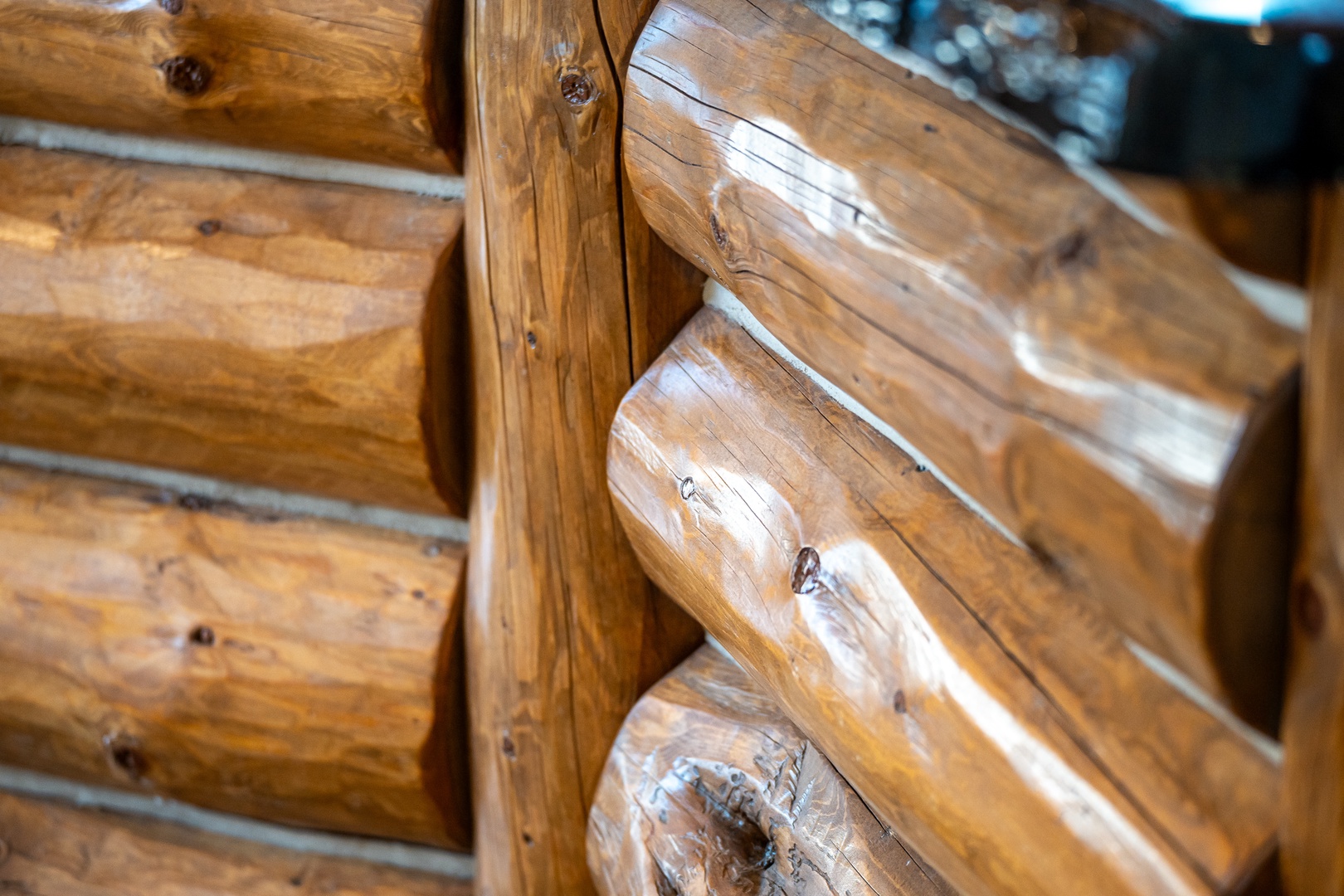 You'll love the authentic character of these handcrafted log walls, where natural wood grain tells stories of timeless craftsmanship.