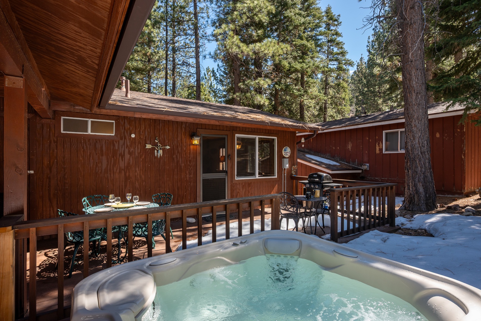 Soak in your private hot tub on the deck, surrounded by towering pines and crisp mountain air. Dine al fresco, grill up dinner, and unwind under the stars.