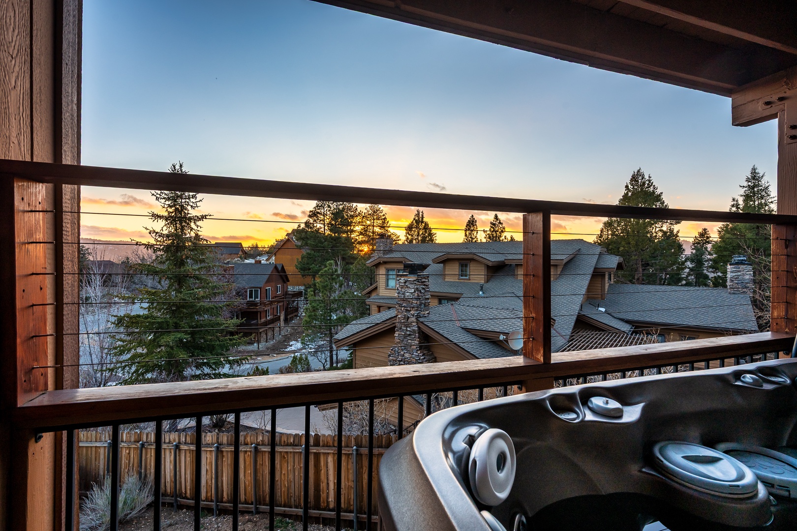 Private balcony with sunset views over the neighborhood, perfect for evening relaxation with your morning coffee or evening cocktail.