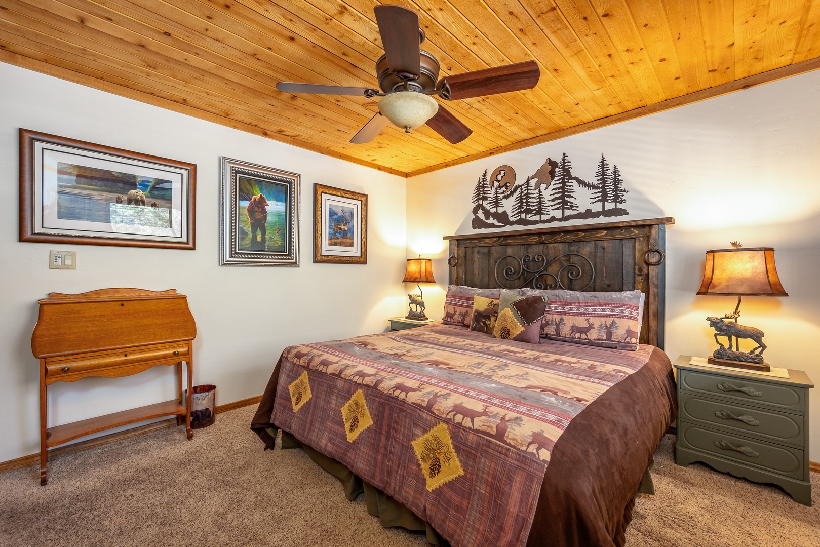 Drift off to sleep under the warm glow of rustic cabin charm, with cozy mountain-themed bedding and handcrafted touches creating your perfect retreat.