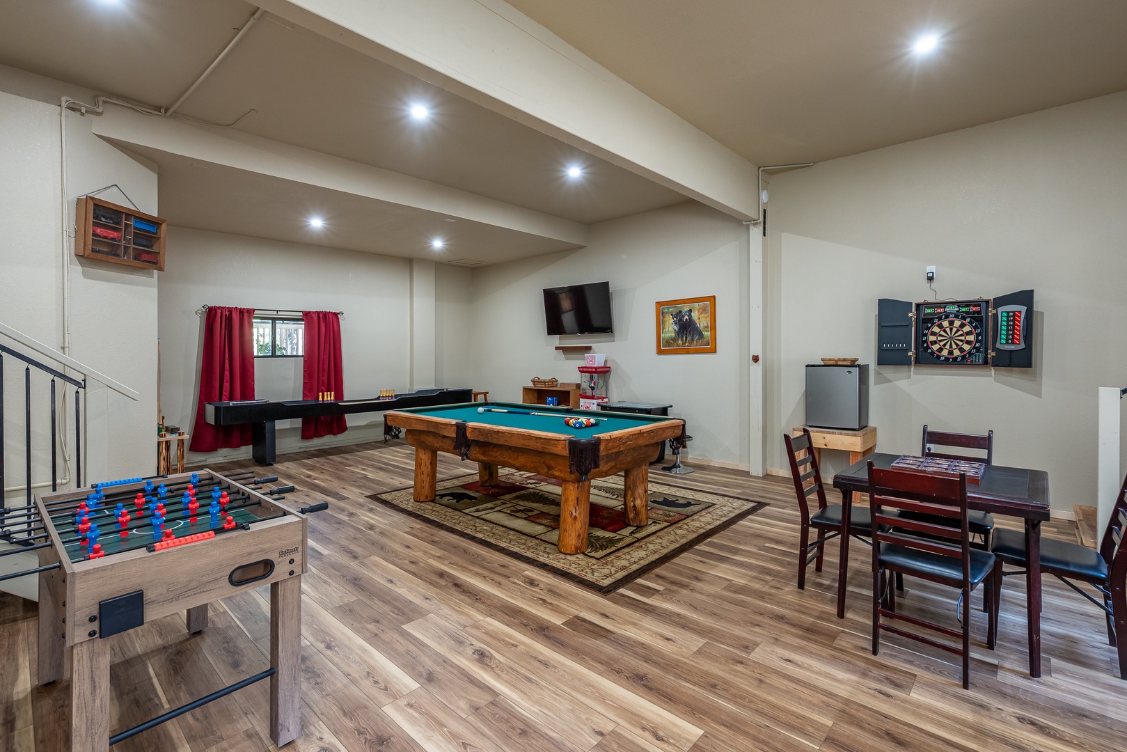 Your private game room awaits with a full-size pool table, foosball, darts, and dining space—perfect for friendly competitions and late-night fun with family and friends.