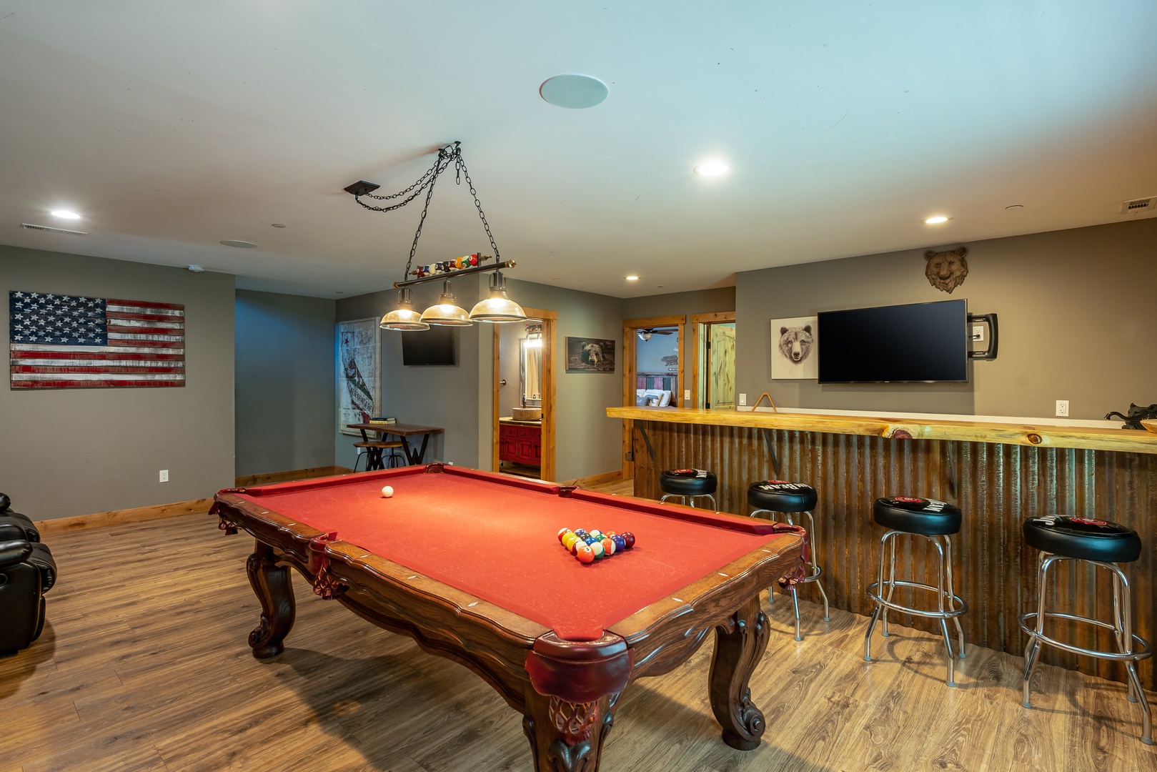 Challenge friends to pool, gather at the bar, and enjoy endless fun in this inviting game room designed for laughter and memorable moments.
