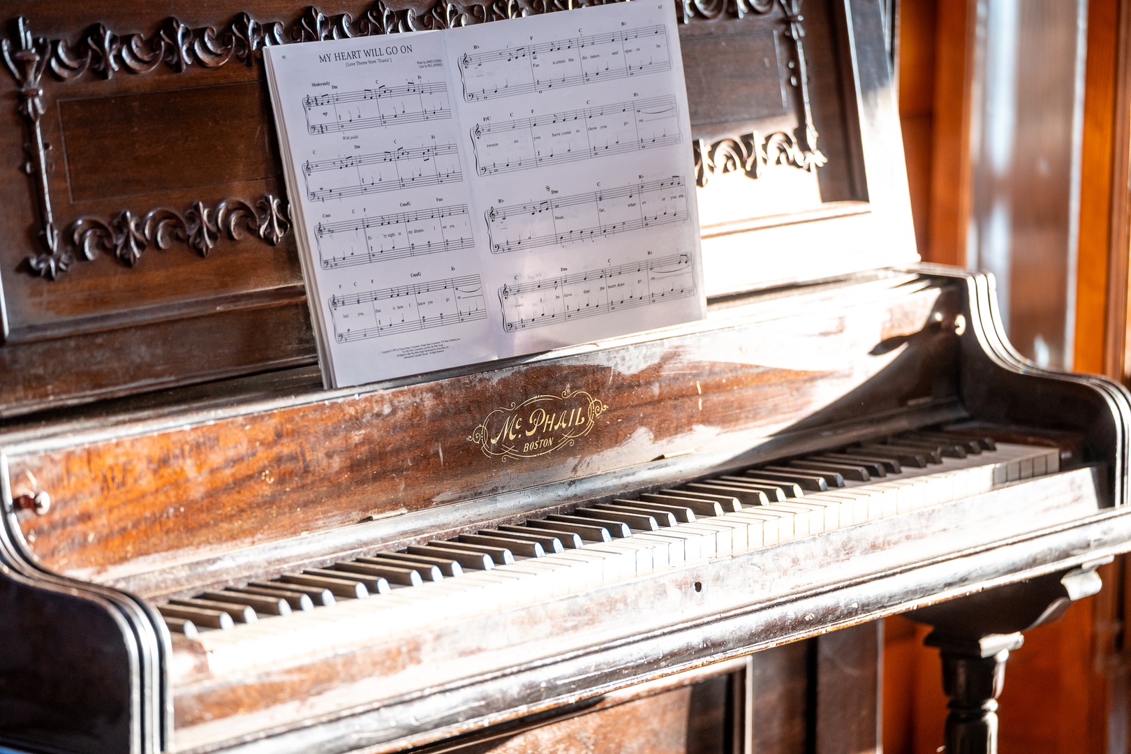 Let your musical side shine on this charming vintage piano, perfect for creating memorable melodies during your stay.