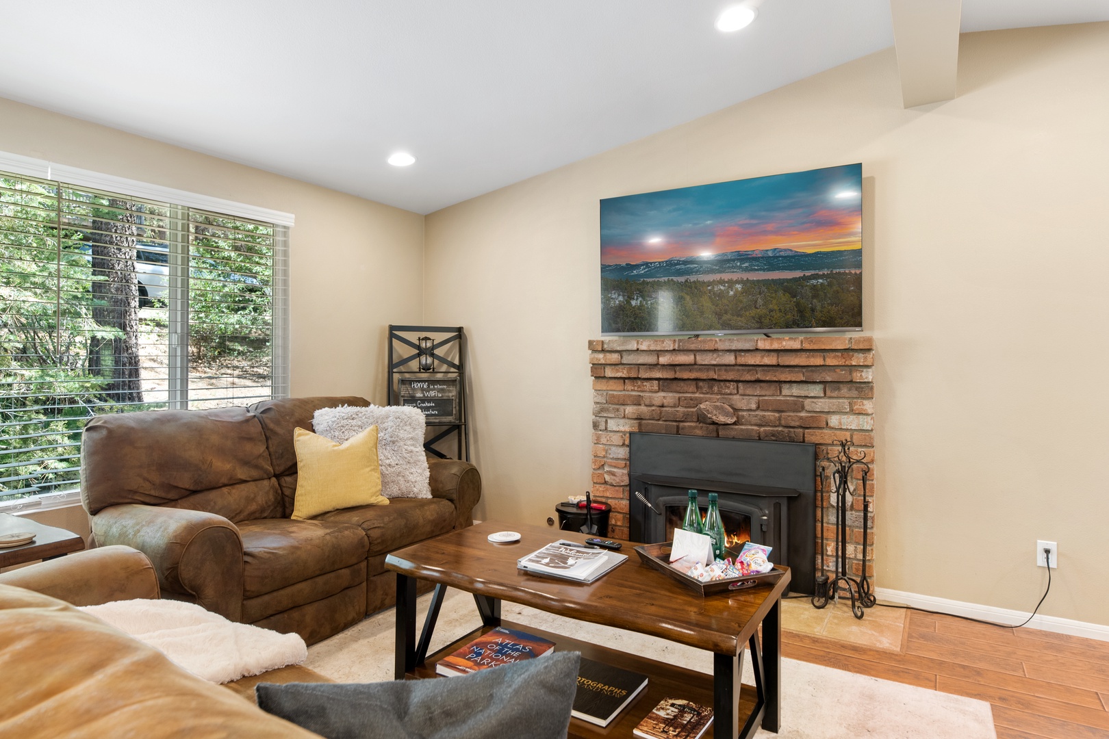 Curl up on the plush sofa by the warm fireplace, where natural light pours in and mountain views inspire your perfect getaway.