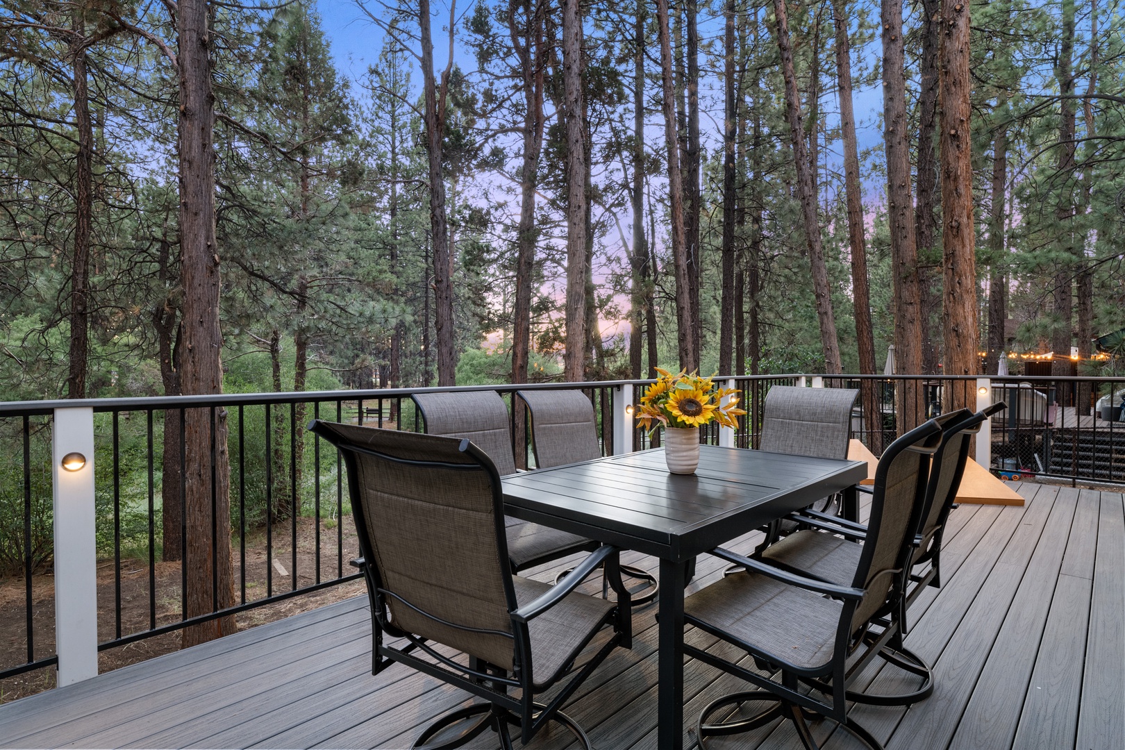 Picture yourself dining outdoors, surrounded by towering pines and fresh mountain air. Your private deck offers a peaceful retreat where mornings feel magical and evenings glow.