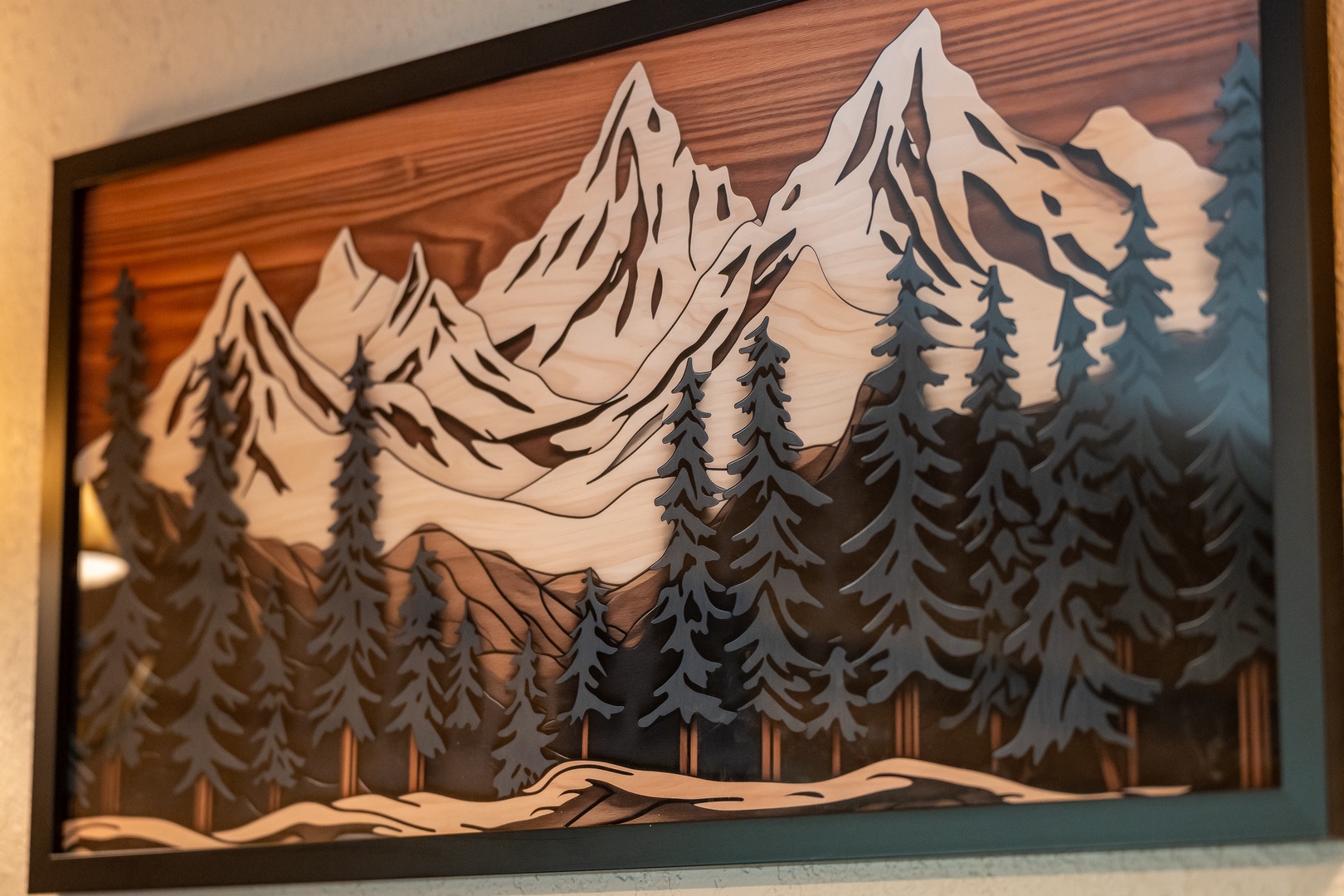 This layered mountain scene artwork brings natural beauty and craftsmanship into your space, creating a peaceful, outdoorsy atmosphere.