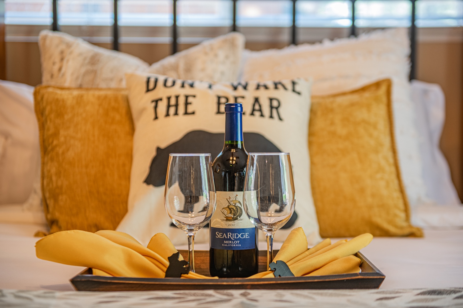 Unwind with your favorite wine in this cozy bedroom retreat, where plush pillows and thoughtful touches await your arrival.