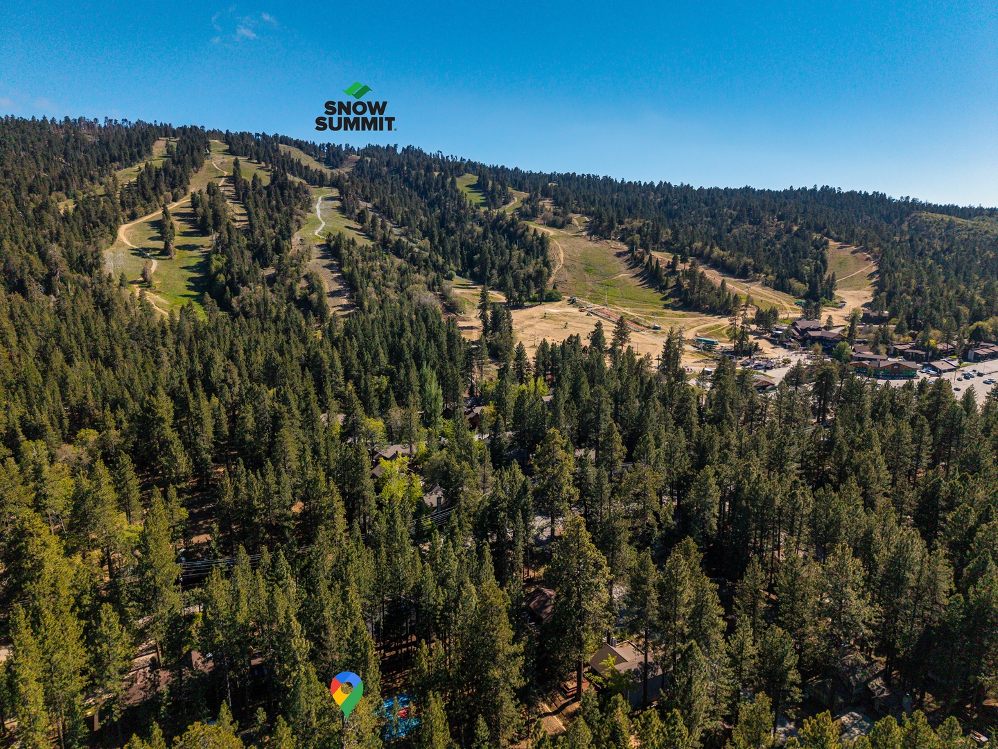 Snow Summit ski resort rests amid dense pine forests, offering groomed runs and mountain vistas in the surrounding San Bernardino area.