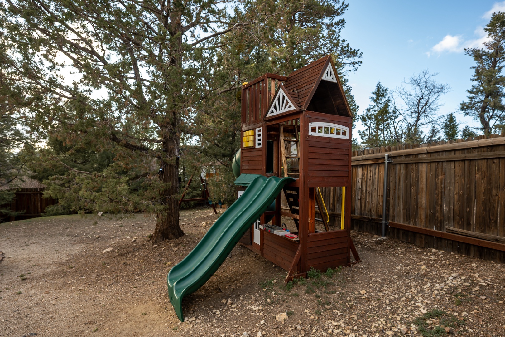 Your little ones will love this charming wooden playground in the secure backyard, complete with slides and endless adventure possibilities.