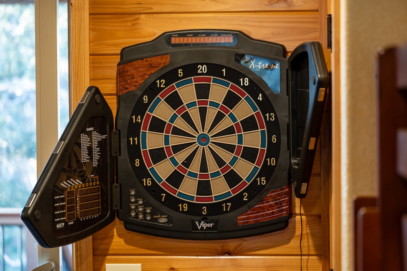 Challenge friends to a game on this electronic dartboard, perfect for fun evenings in your cozy retreat.