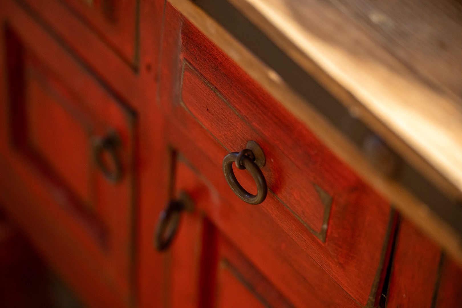 Beautiful wooden cabinetry with classic bronze ring pulls adds warm, rustic charm to your space. Every detail is chosen to make you feel right at home.