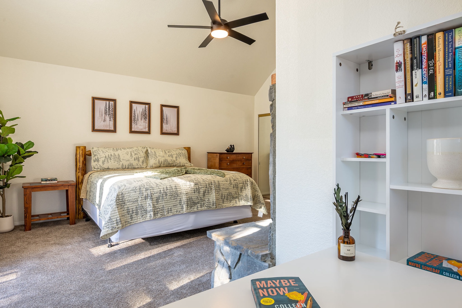 Relax in your thoughtfully designed bedroom featuring a comfortable bed, and built-in library and work nook