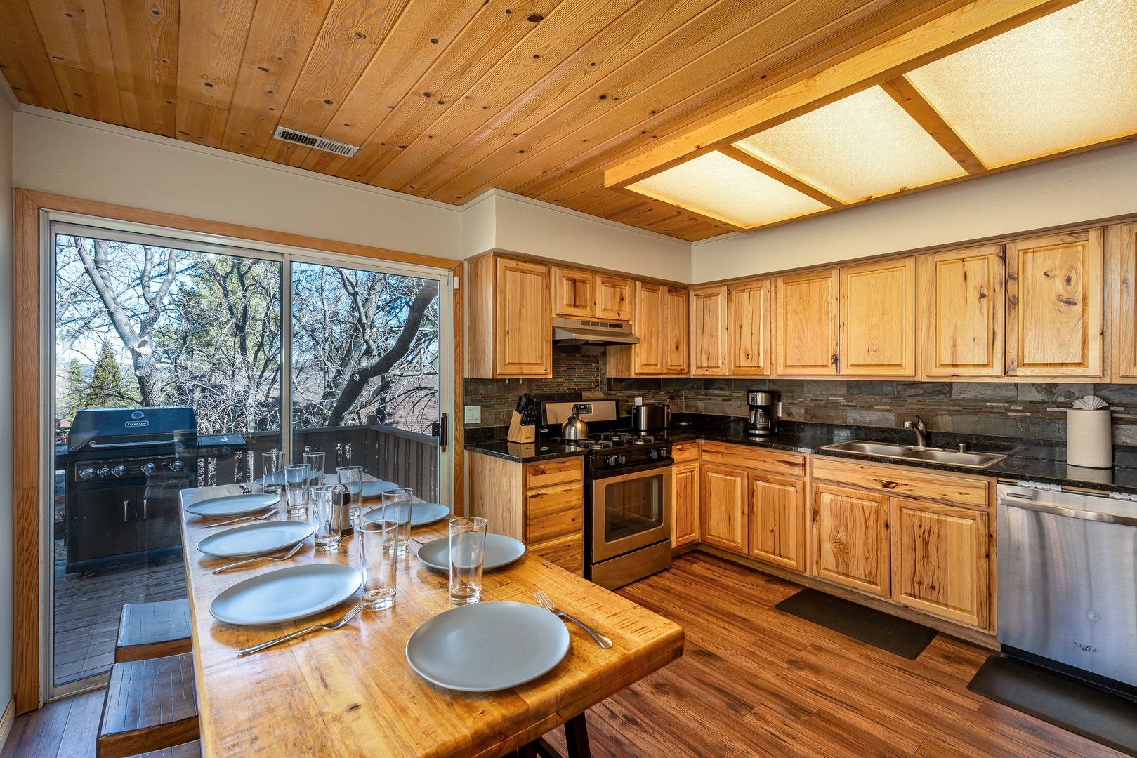 You'll love cooking in this warm wooden kitchen with its rustic charm and modern appliances, perfect for creating memorable meals together.