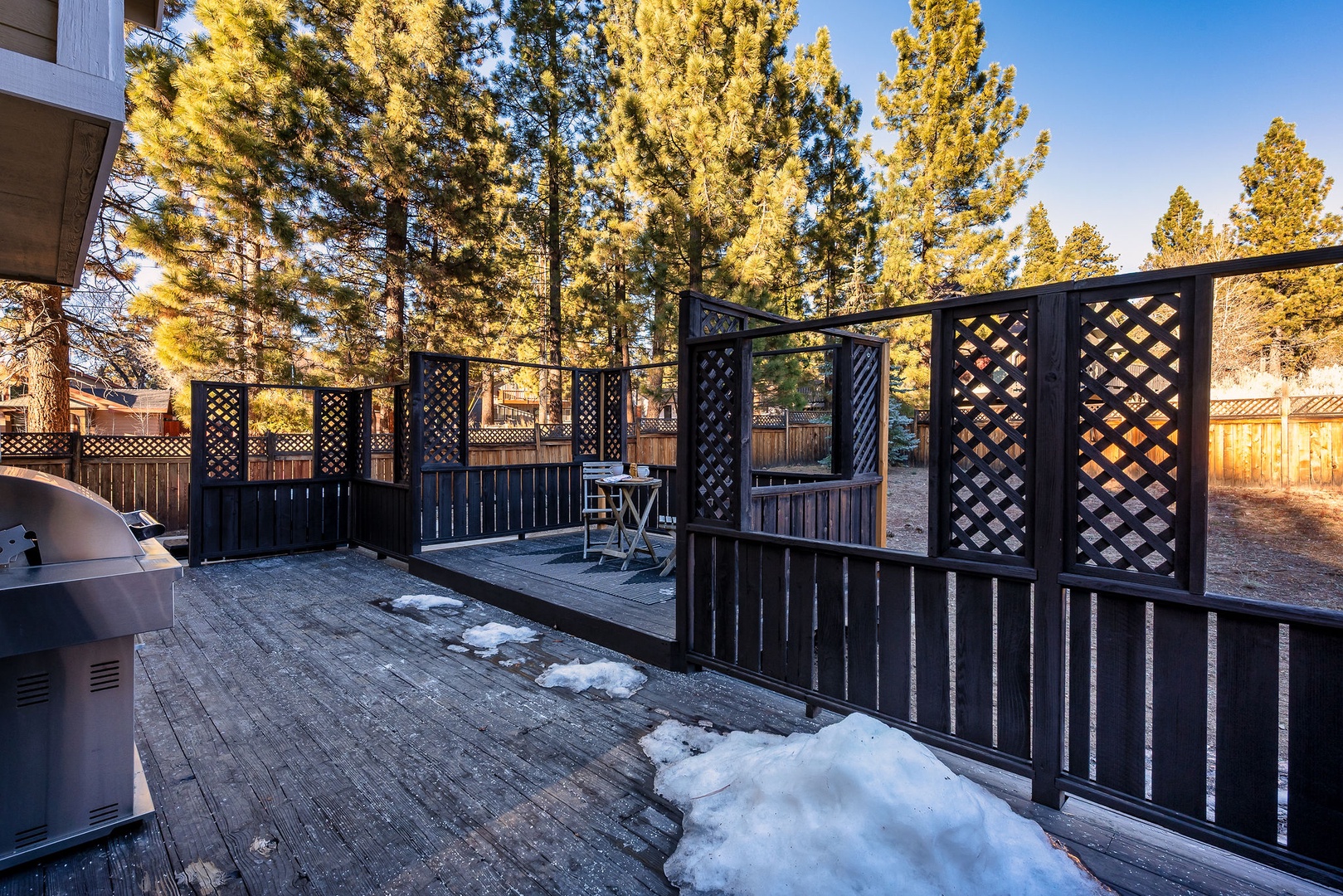 Step out onto your private deck surrounded by towering pines, where you can fire up the grill and enjoy meals with a backdrop of golden trees and crisp mountain air.