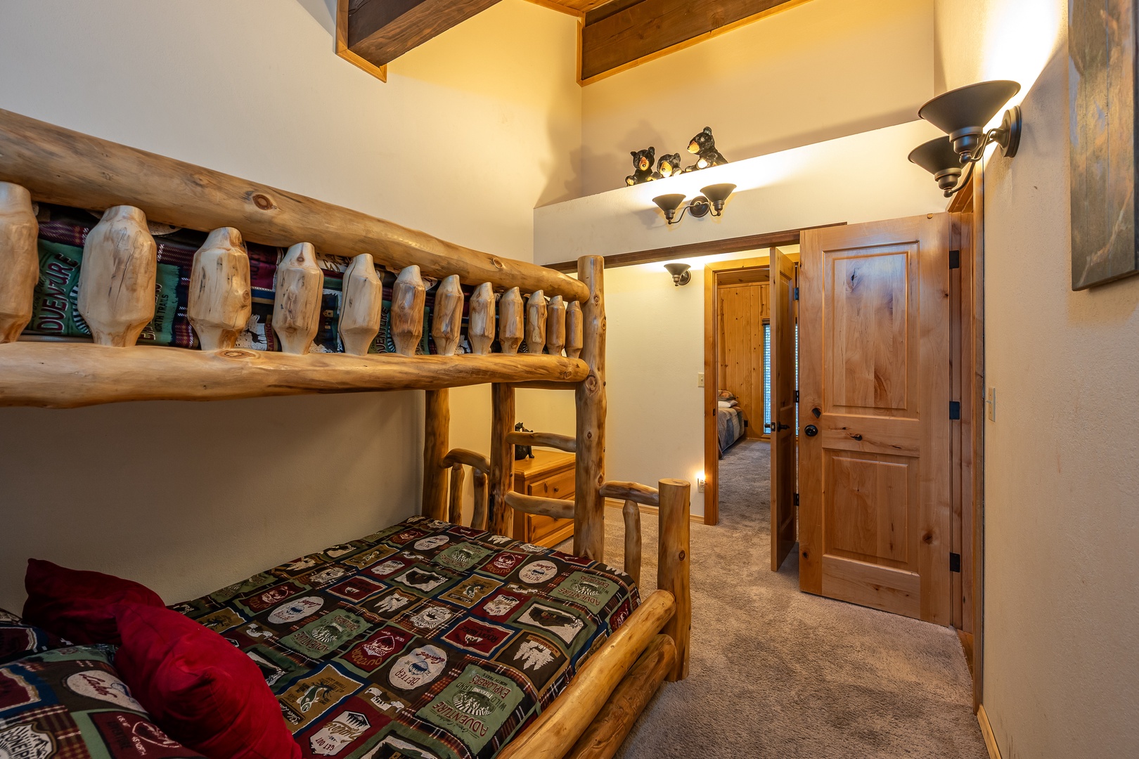 Your kids will love this cozy log bunk bed nook with rustic mountain charm, vaulted ceilings, and playful woodland touches that make bedtime an adventure.