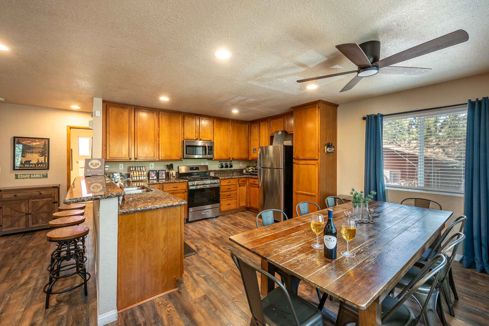 Gather around this rustic farmhouse table in your fully-equipped kitchen with granite counters, stainless steel appliances, and ample space for cooking and entertaining together.