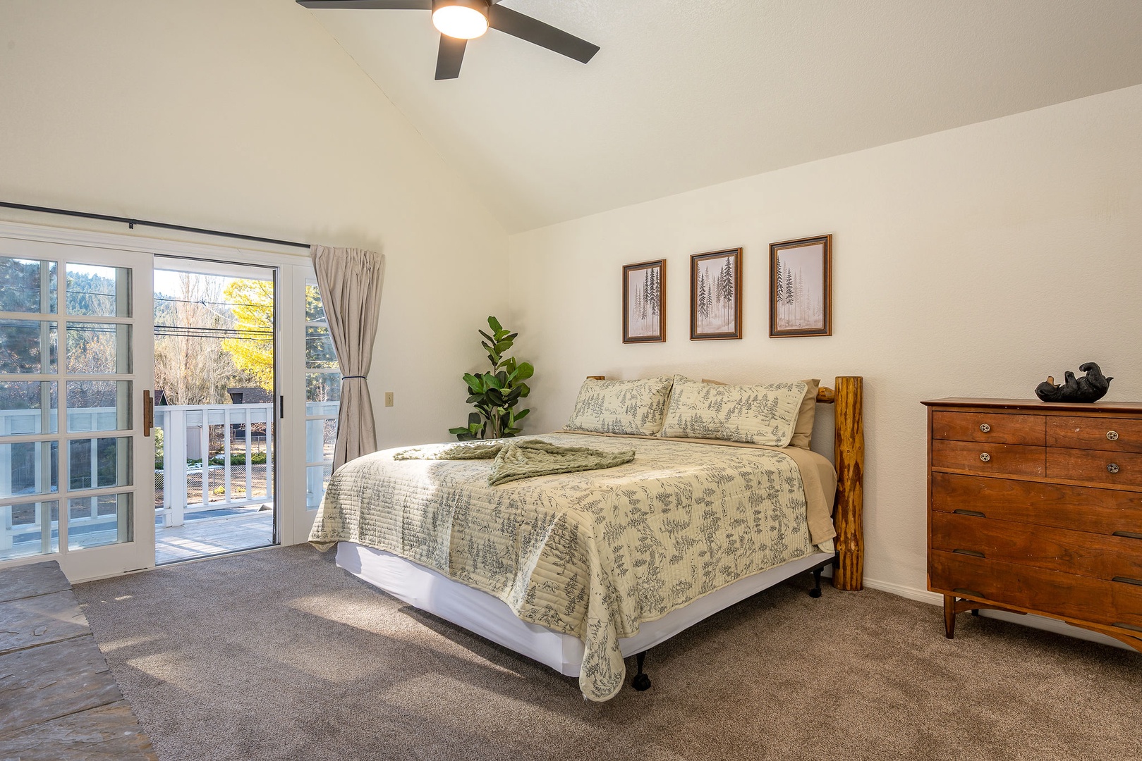 Relax in your spacious bedroom with French doors opening to your private patio, complete with comfortable bedding and warm wood furnishings.