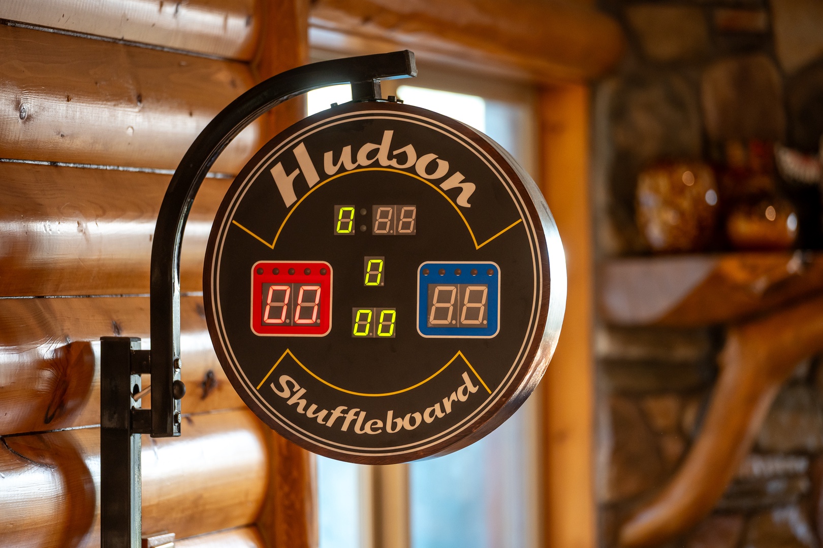 Challenge friends to exciting shuffleboard matches in your cozy log cabin retreat, where rustic charm meets competitive fun.