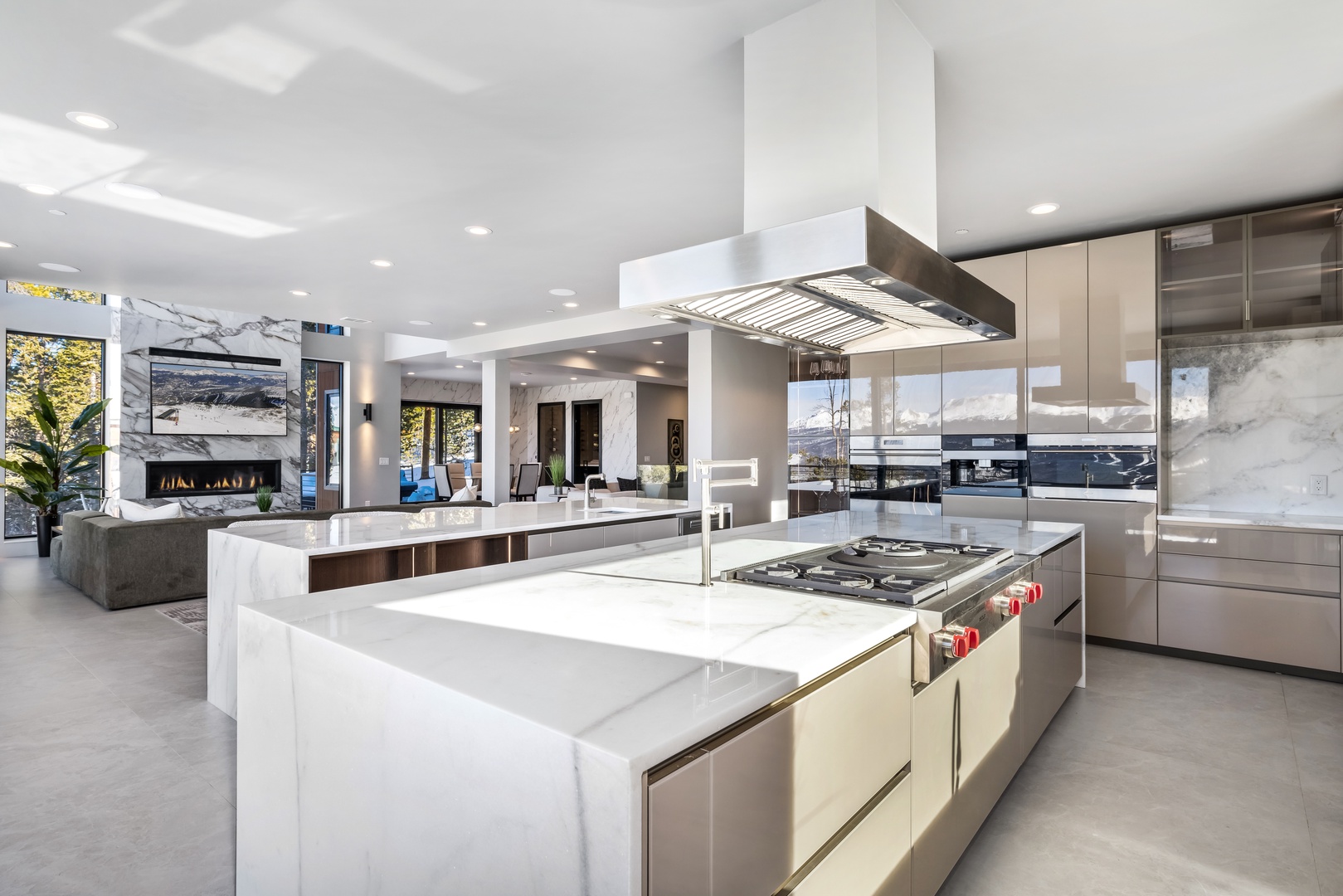 Your gourmet kitchen features marble countertops, professional appliances, and an elegant island perfect for cooking memorable meals together.