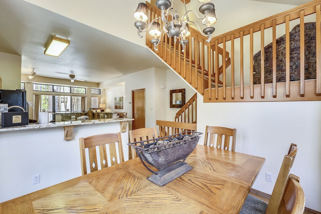 Your elegant dining space features warm wood tones and an open floor plan that connects to the kitchen, perfect for memorable meals.