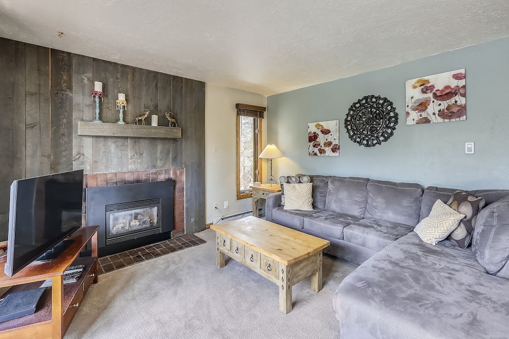 Sink into this plush sectional and warm up by your cozy fireplace after mountain adventures.