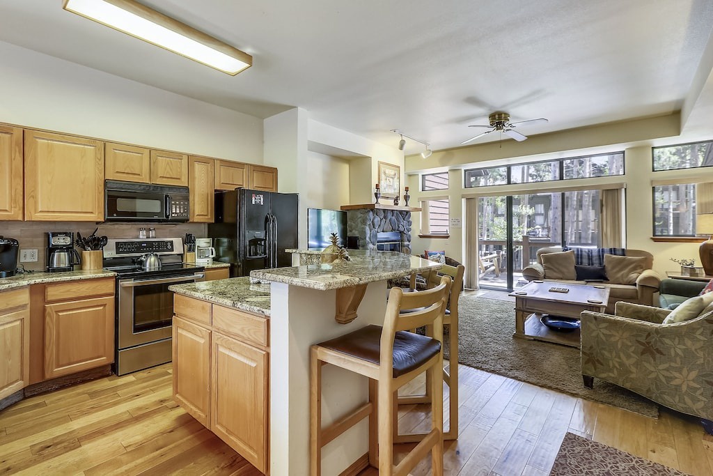 Your fully equipped kitchen flows seamlessly into the cozy living area, perfect for cooking meals and relaxing together.