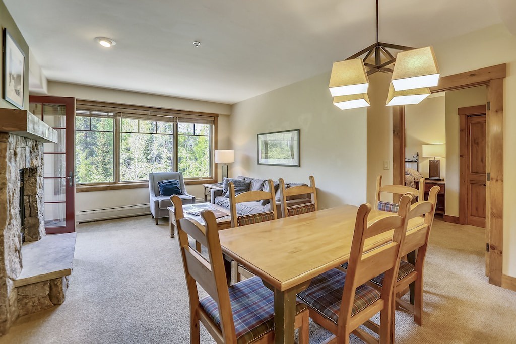 Gather around your spacious dining table where mountain views create the perfect backdrop for memorable meals with family and friends.