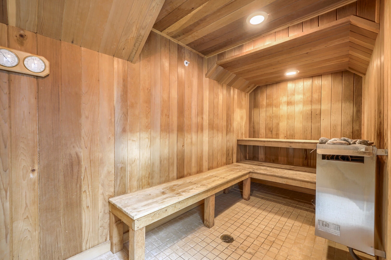 Warm cedar-lined sauna with tiered benches invites you to unwind after a day of adventure.