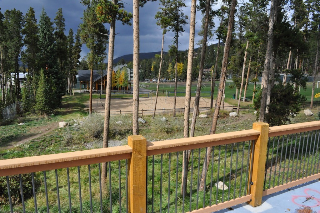 Mountain forest and recreational area visible from elevated deck position at the property.