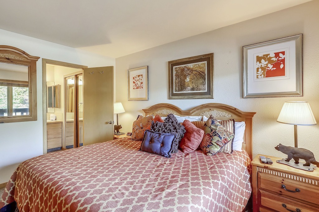 Your cozy bedroom features a comfortable bed with plush pillows and warm lighting for peaceful nights.