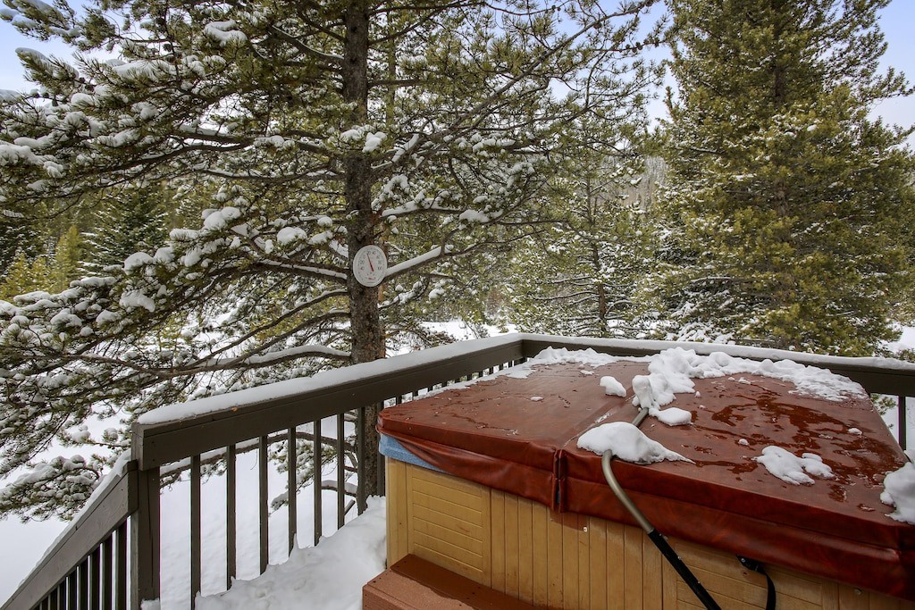 Soak in steaming warmth while snow blankets the trees around you—your private winter hot tub paradise awaits.