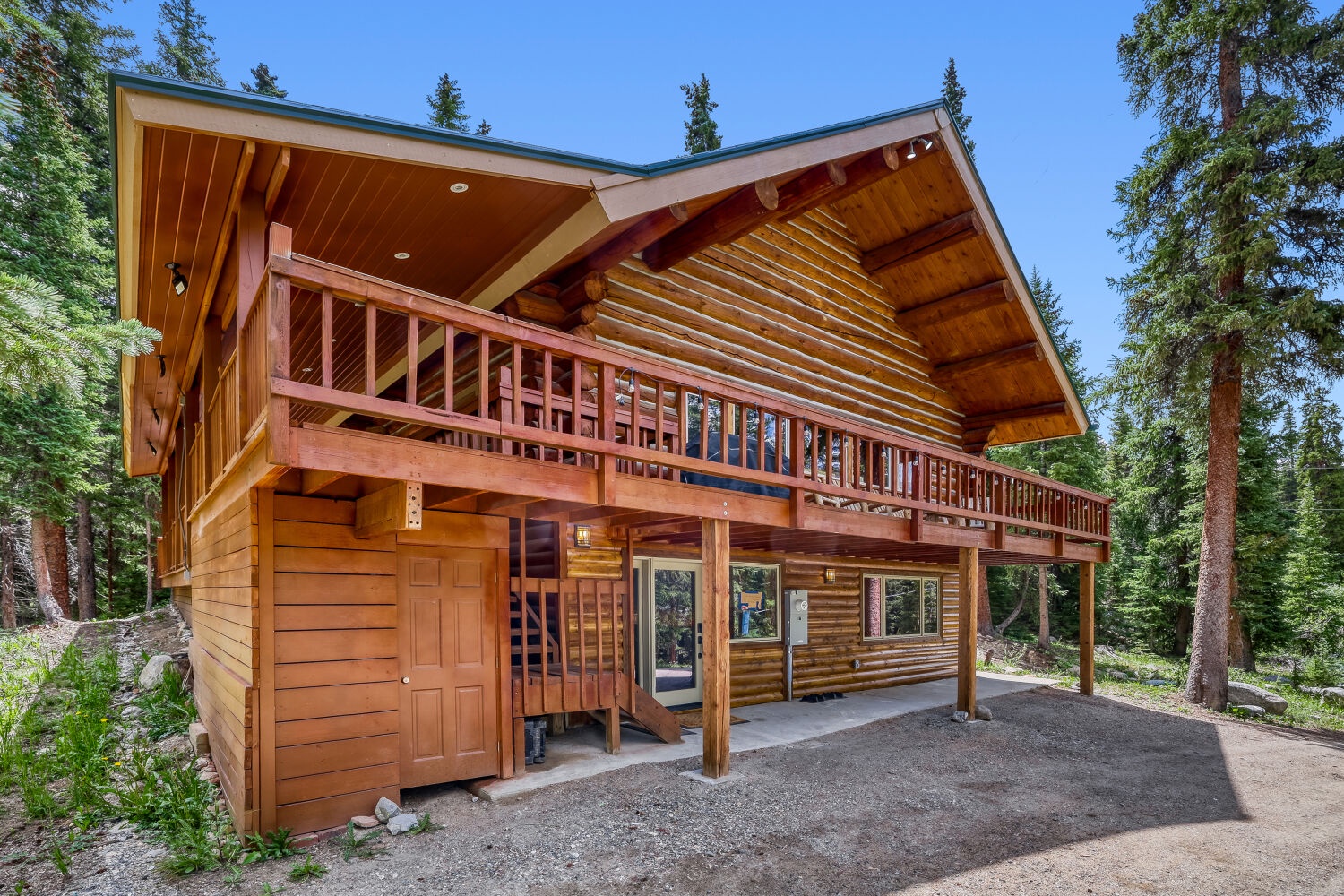 Nestled in a serene forested setting, this charming log cabin features a spacious balcony and rustic wood details that perfectly complement the surrounding natural landscape.