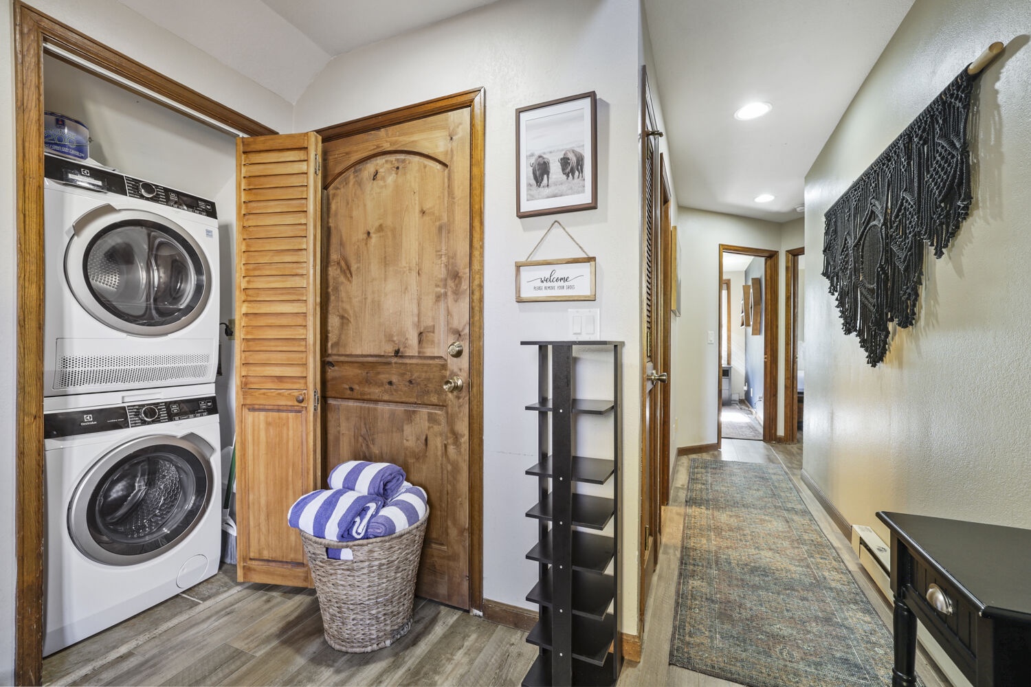 Your convenience is covered with a stacked washer and dryer tucked behind louvered doors, plus extra storage for all your essentials.
