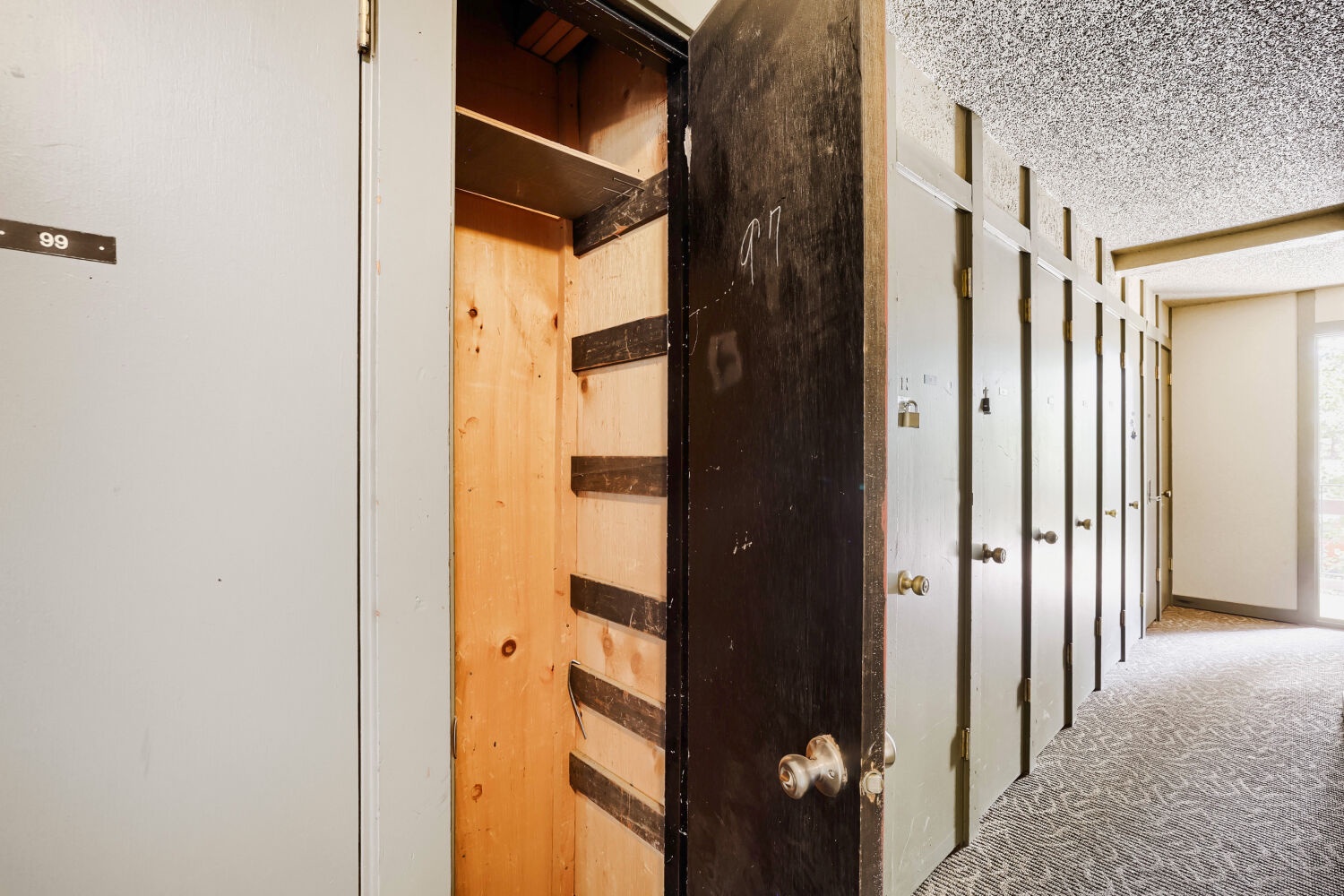 Storage lockers line the hallway for your convenience—secure and spacious for all your gear during your mountain escape.