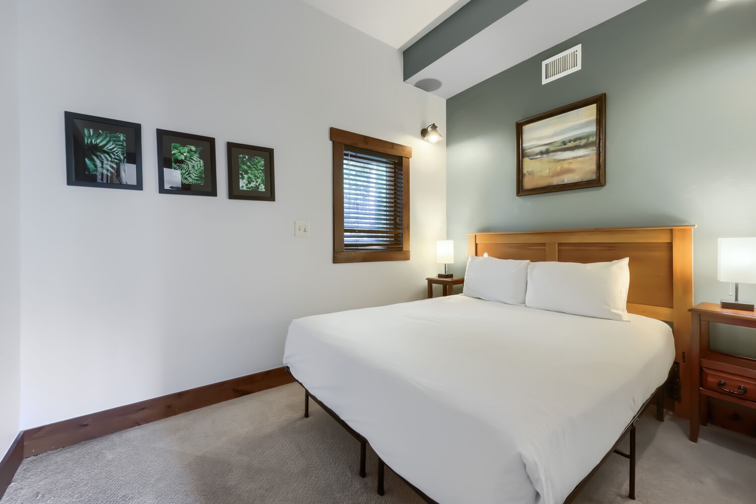 Unwind in your peaceful bedroom, where vaulted ceilings and soft lighting create a calming retreat after a day of adventure.