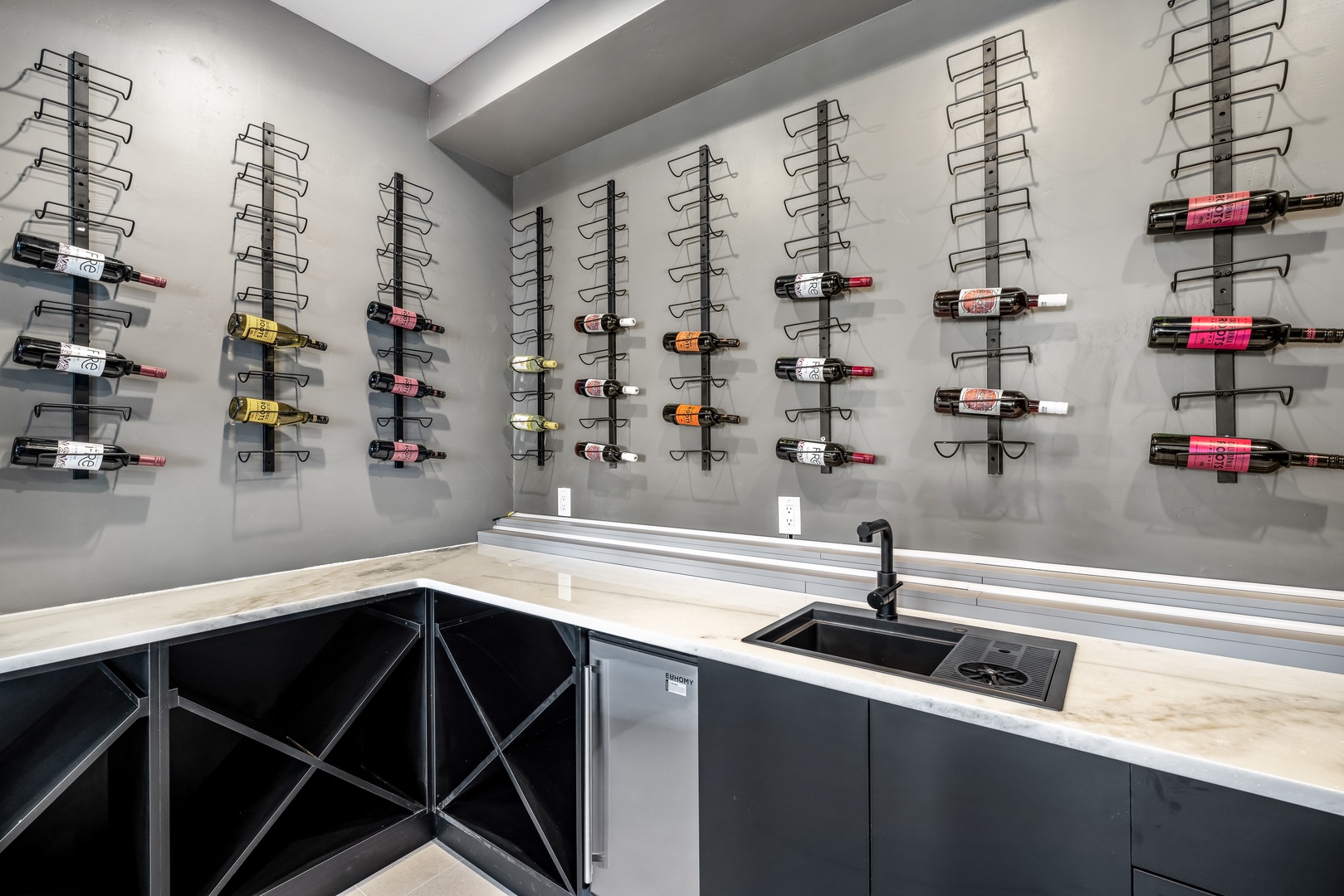Your private wine cellar awaits with extensive storage and prep counter for perfect entertaining moments.