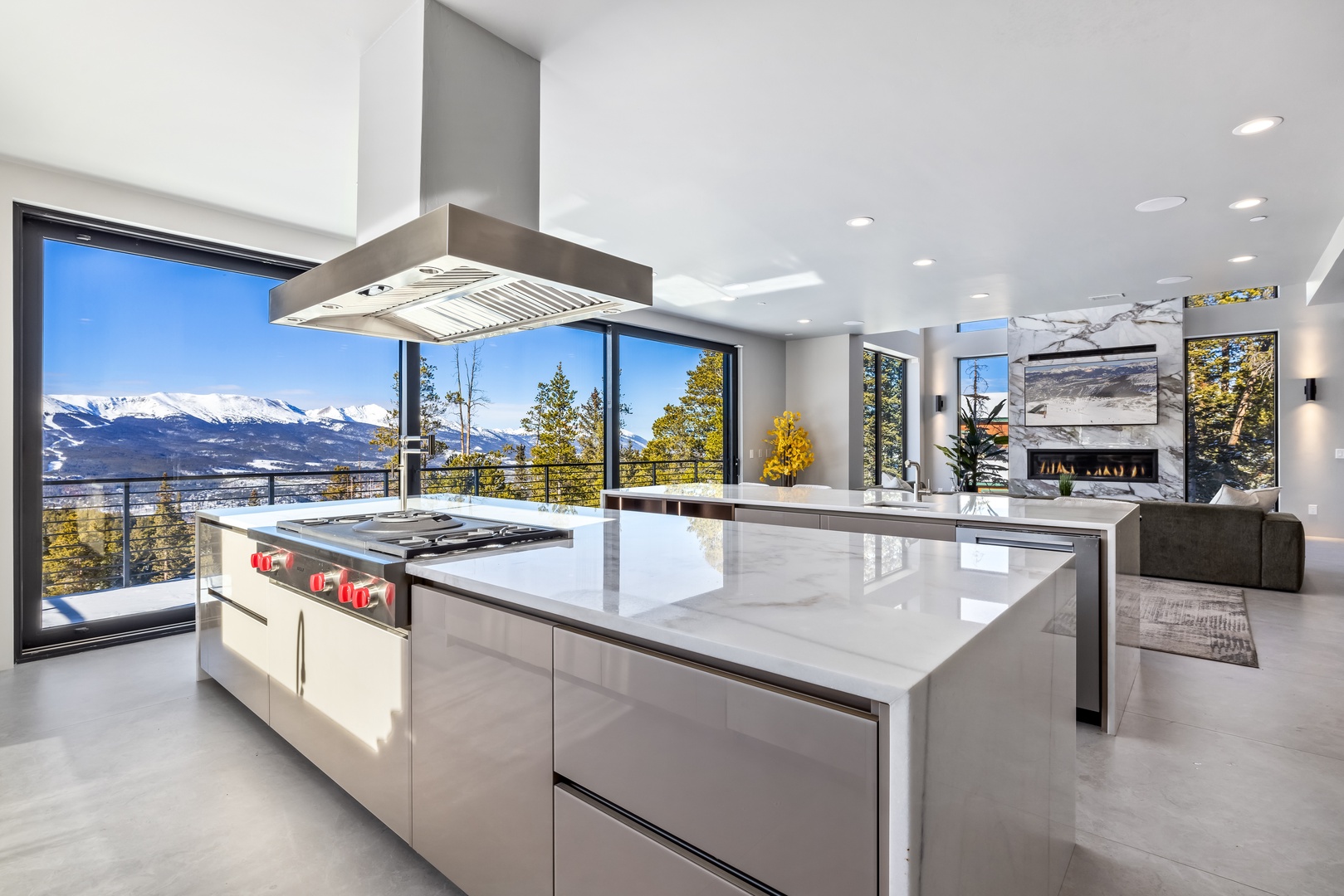 Cook your favorite meals in this stunning modern kitchen with spectacular mountain views framing your culinary experience.