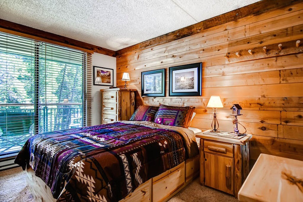 Drift off to sleep surrounded by warm wood walls and cozy lodge-style charm in your peaceful mountain retreat.