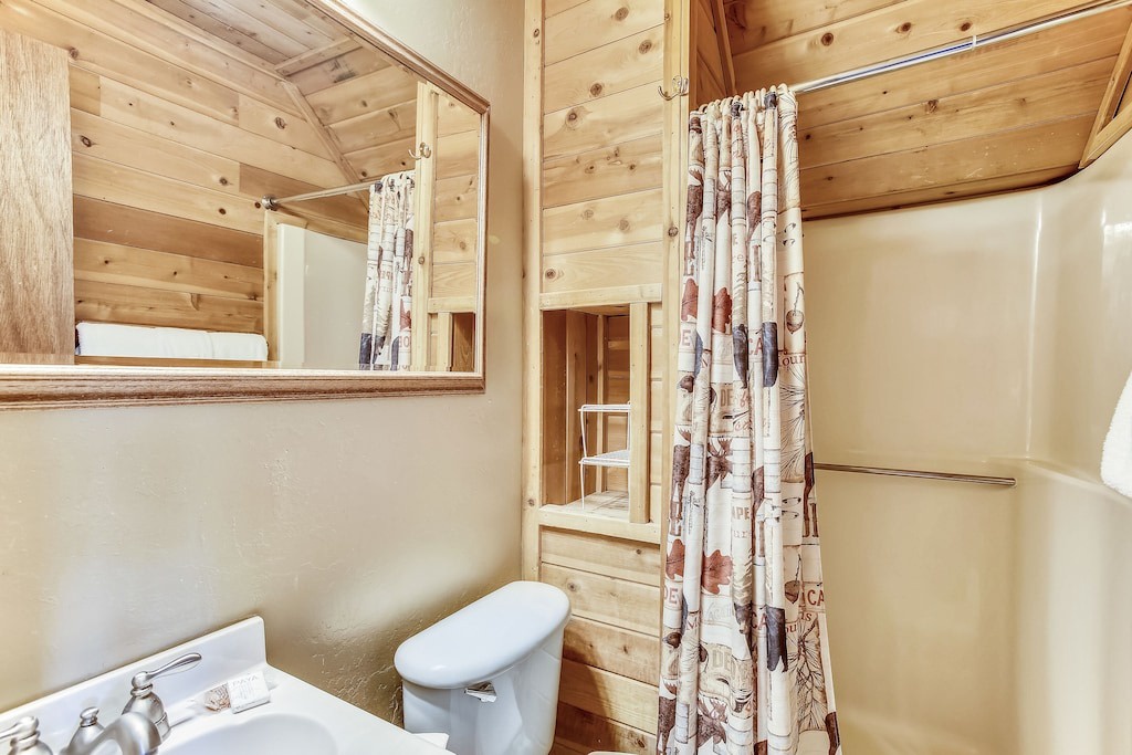 Step into your cozy log cabin bathroom where rustic wood meets modern comfort—perfect for refreshing after mountain adventures.
