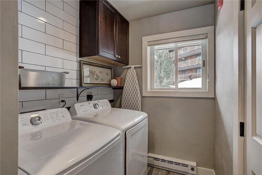 Your own private laundry room makes extended stays effortless with modern machines and stylish storage.