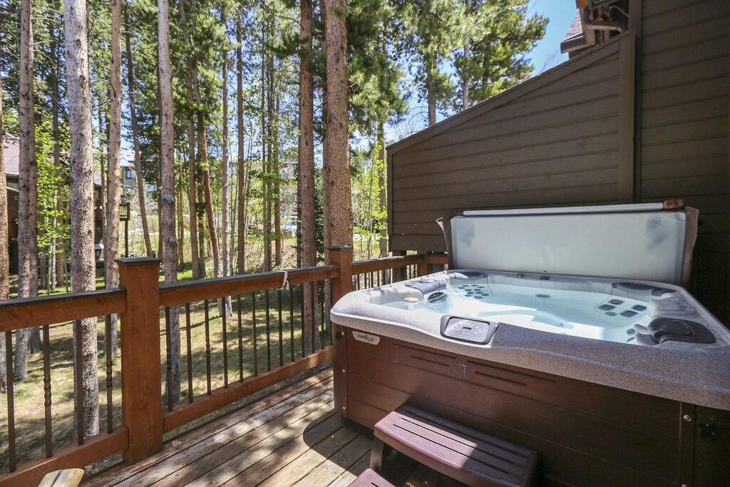 Soak away your stress in this private hot tub surrounded by towering pines on your secluded deck.