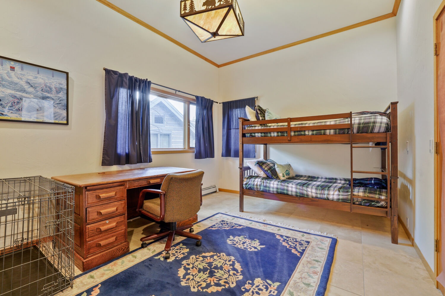 Your kids will love bunking together in this cozy room, complete with a desk for journaling adventures and space to play after a day exploring the mountains.