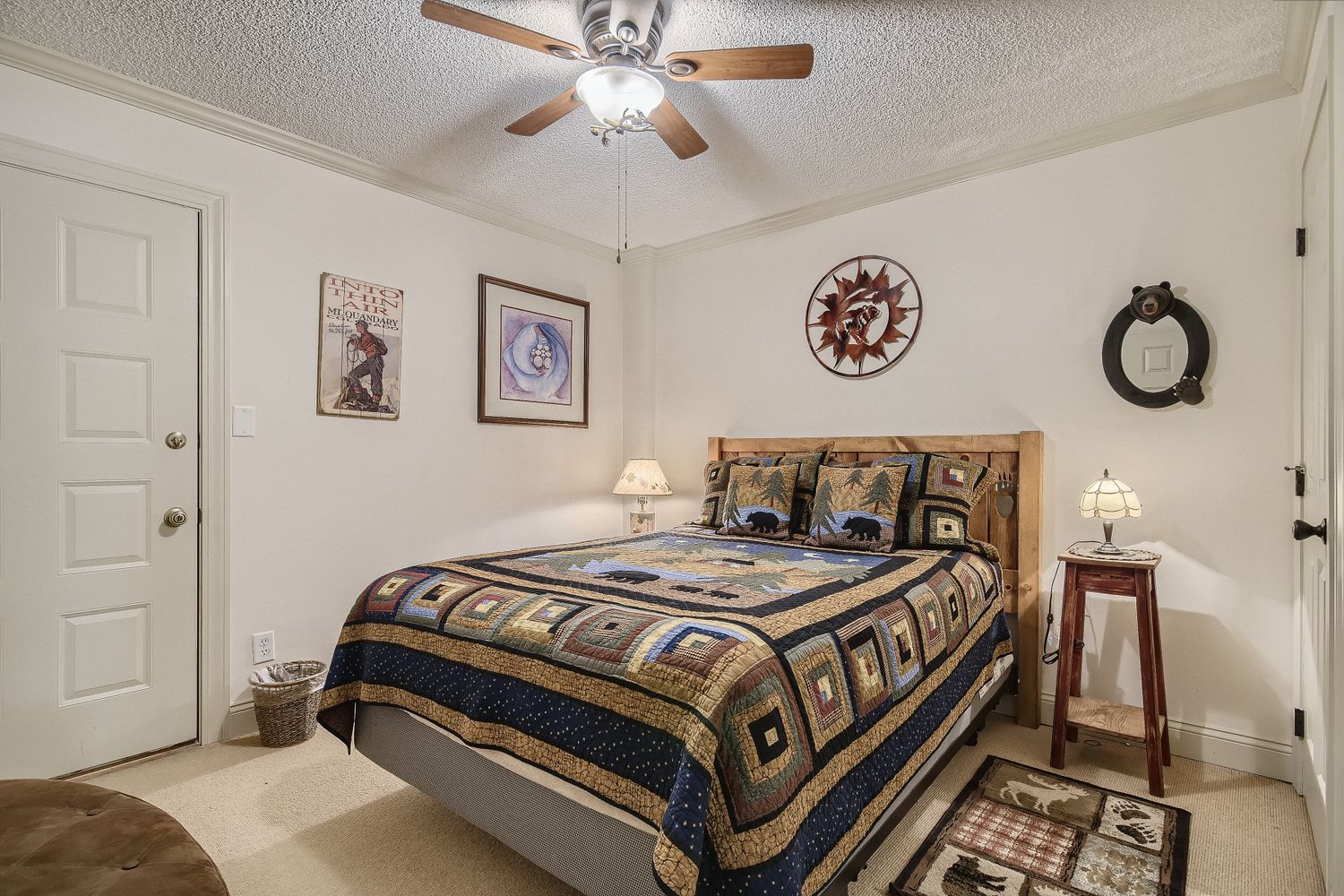Your cozy bedroom features rustic lodge décor with a comfortable queen bed and charming mountain-themed touches throughout.