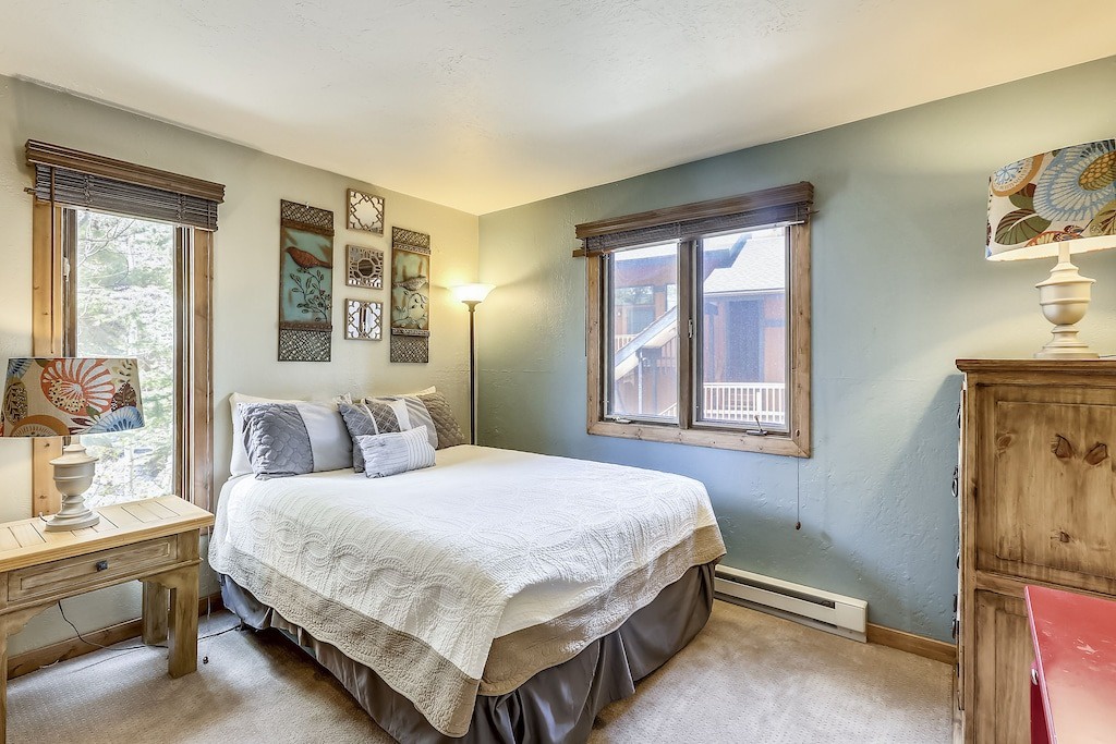 Unwind in your cozy bedroom where soft linens and mountain views create the perfect retreat for peaceful nights.