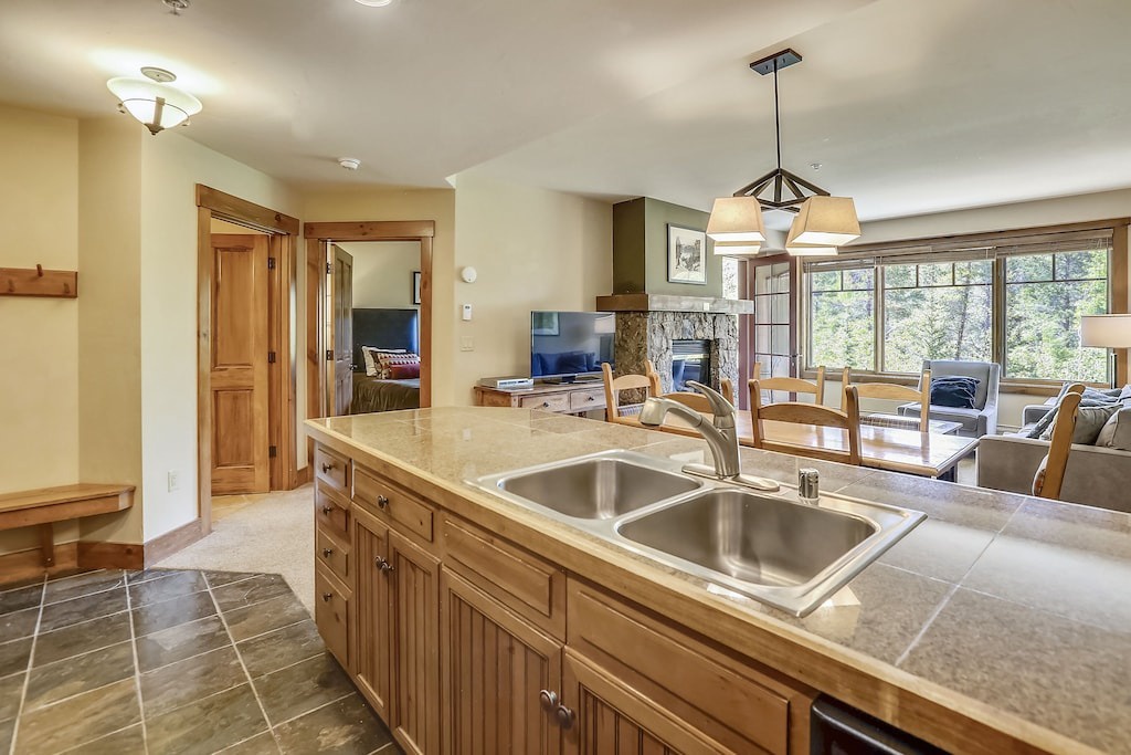 Cook your favorite meals in this spacious kitchen with granite counters, while staying connected to your group in the open living area.
