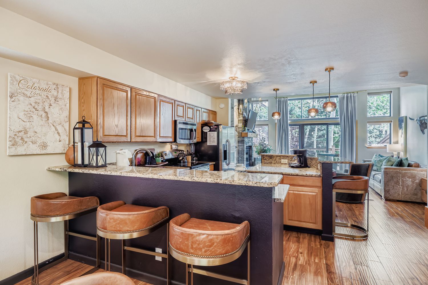 Your spacious kitchen island becomes the heart of your Colorado getaway, perfect for morning coffee and evening conversations.