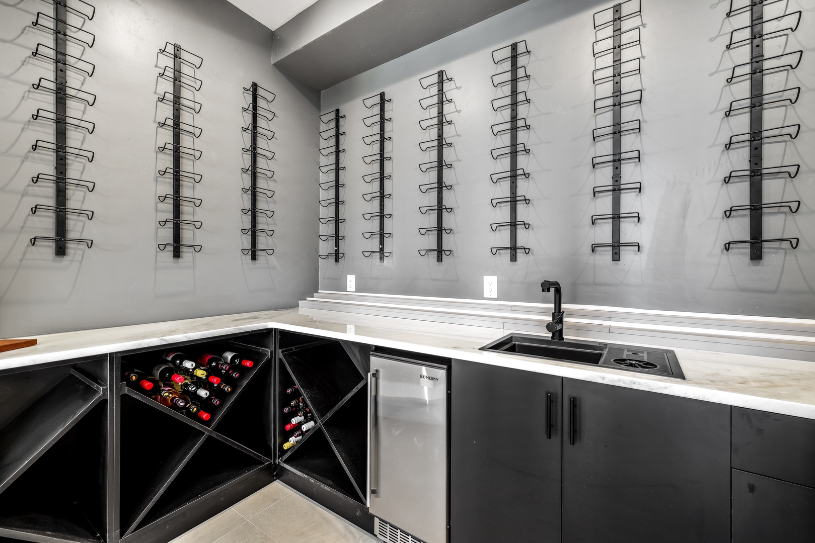 Your private wine cellar awaits, featuring temperature-controlled storage and a sleek prep area for memorable tastings.