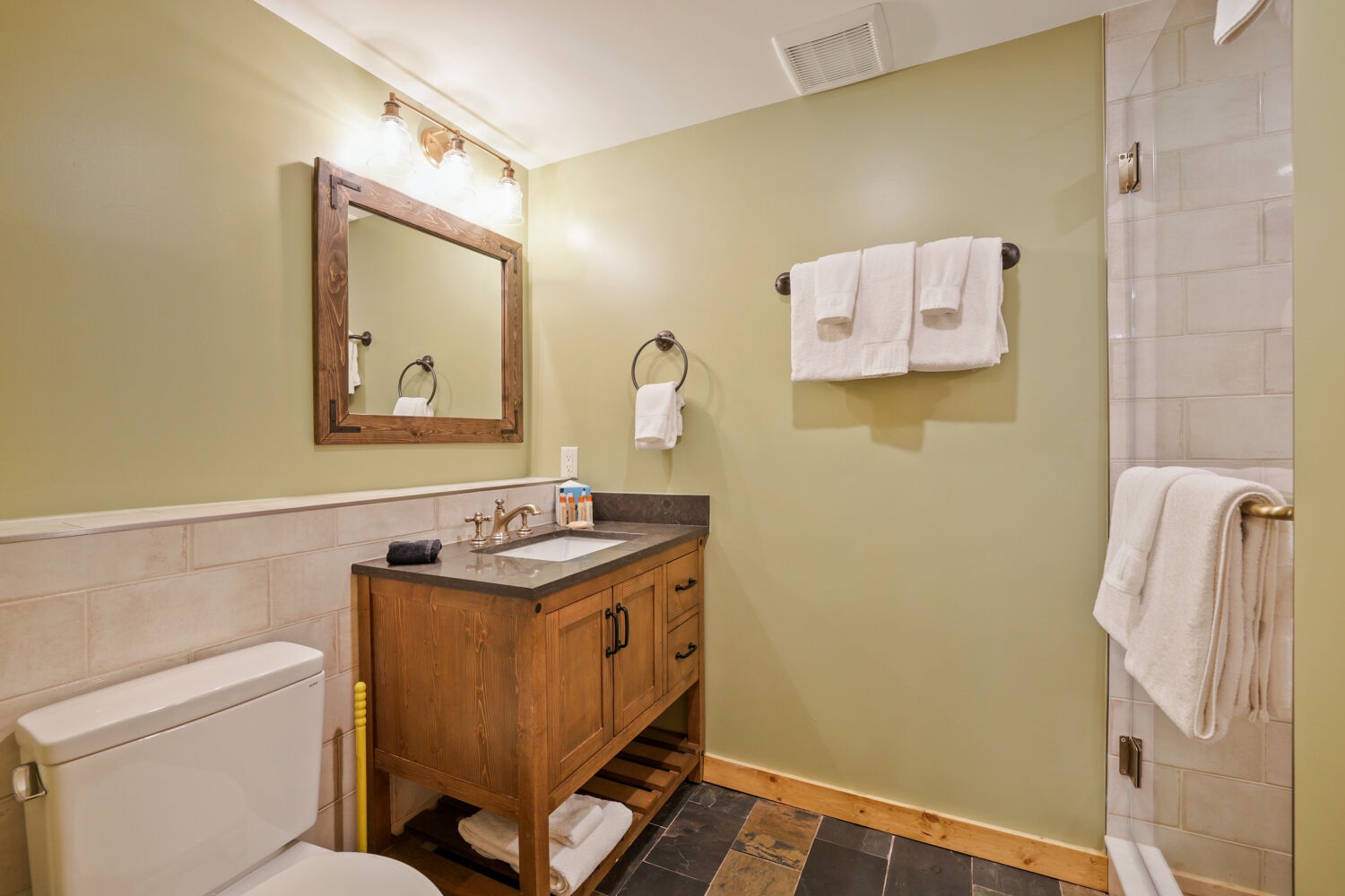 Step into your private retreat with warm tones, rustic wood accents, and plush towels waiting for you. Everything you need for a relaxing stay is right here.